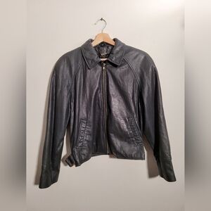 Danier polyurethane leather moto jacket with side belting and chain tag